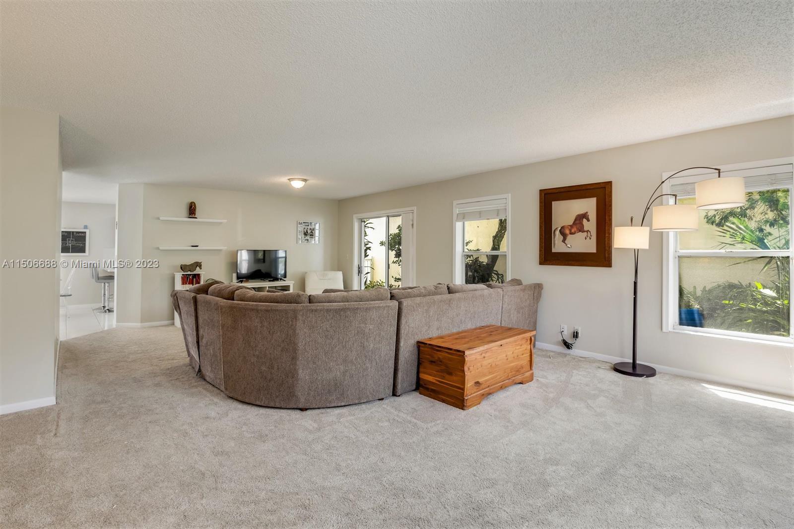 7289 Shell Ridge Terrace Lake Worth, FL 33467 - Photo 8 of 55 a living room with furniture and a window