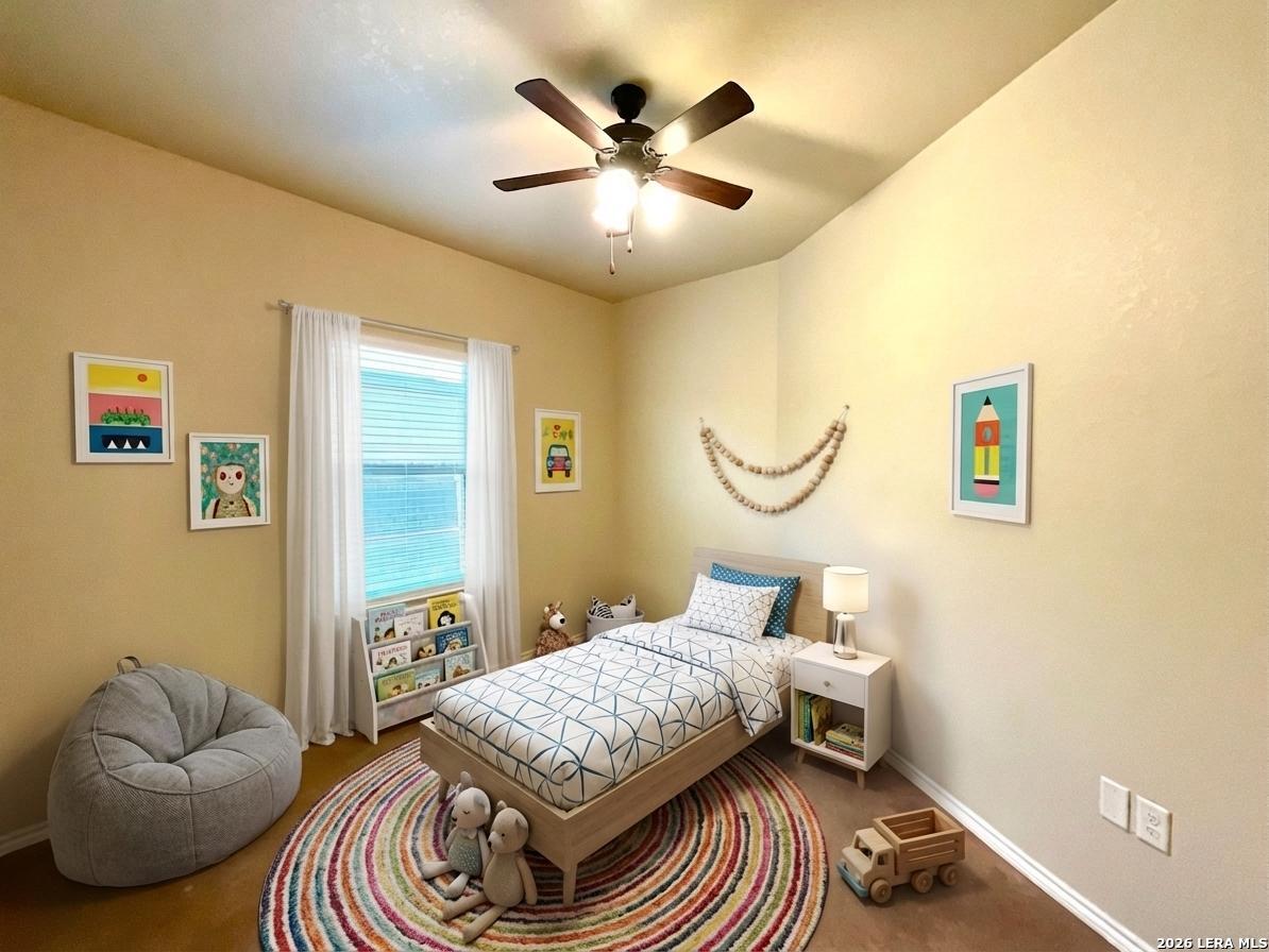 2575 Pahmeyer Road New Braunfels, TX 78130 - Photo 20 of 31 a bedroom with a bed and window