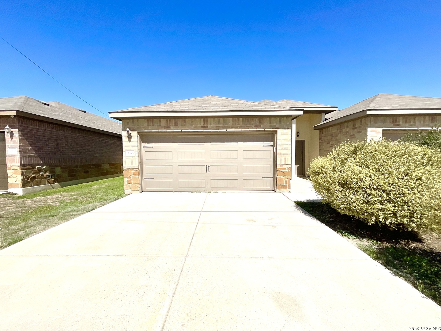 2575 Pahmeyer Road New Braunfels, TX 78130 - Photo 2 of 31 a front view of a house with a yard and garage