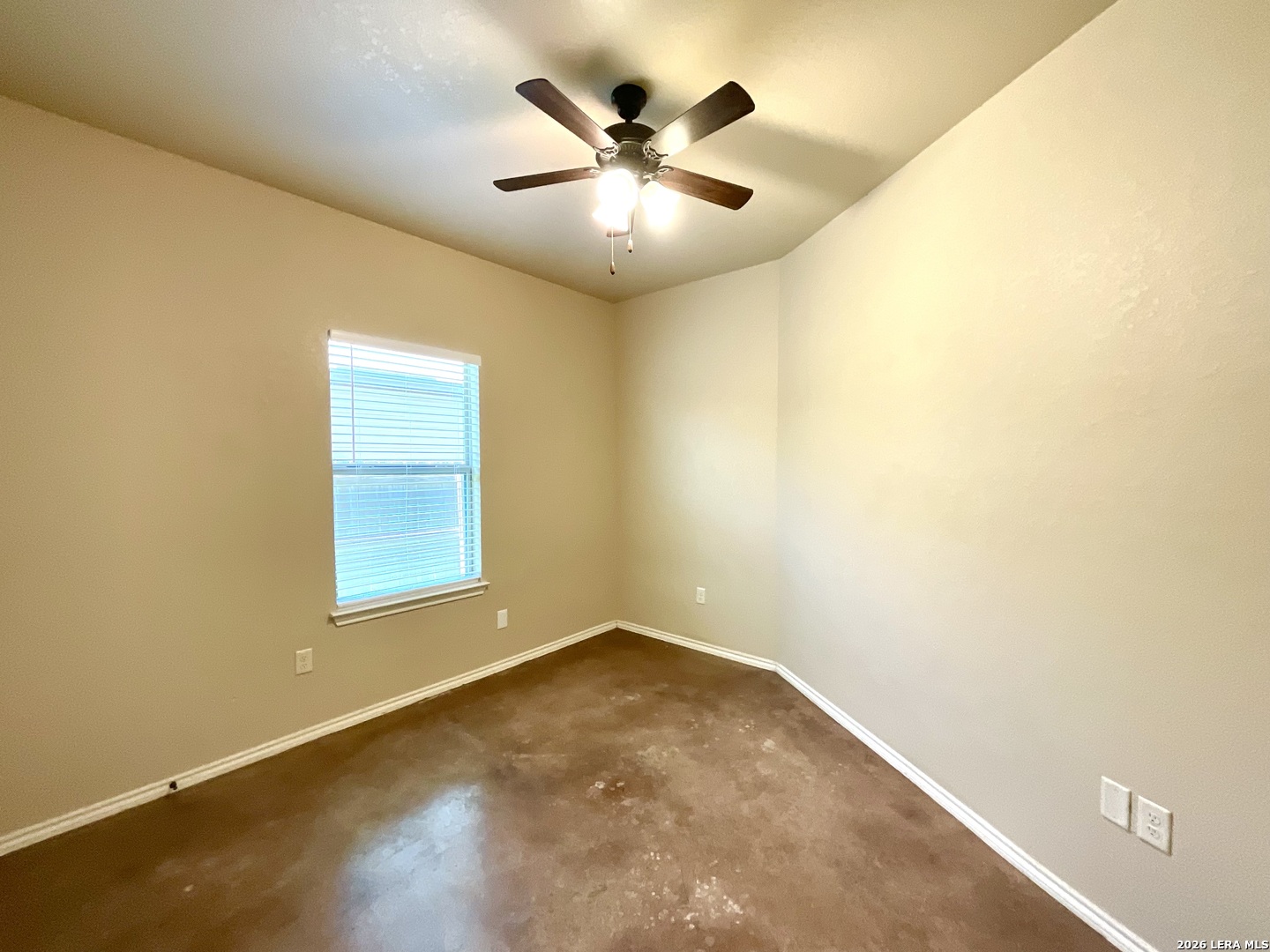 2575 Pahmeyer Road New Braunfels, TX 78130 - Photo 21 of 31 an empty room with a ceiling fan and window
