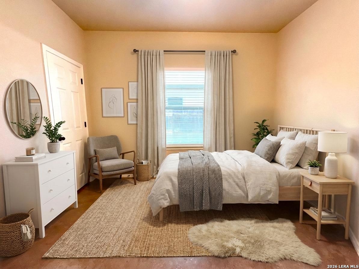 2575 Pahmeyer Road New Braunfels, TX 78130 - Photo 23 of 31 a bedroom with a bed a mirror and a window
