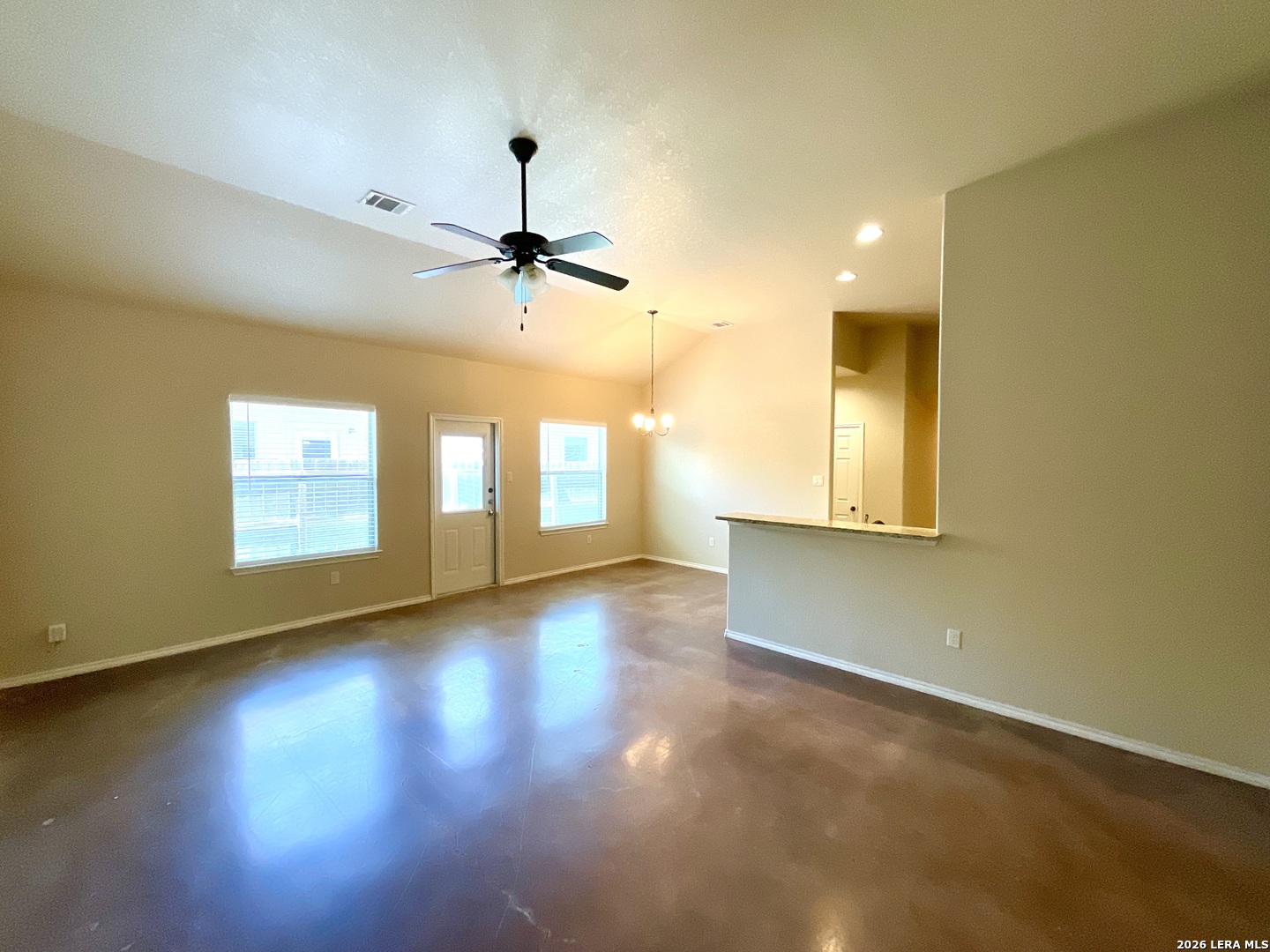2575 Pahmeyer Road New Braunfels, TX 78130 - Photo 6 of 31 a view of an empty room with a window and wooden floor