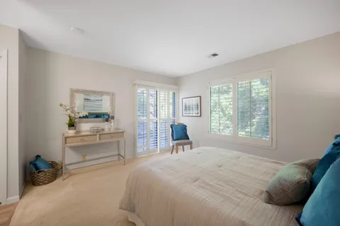 a bedroom with bed and a window