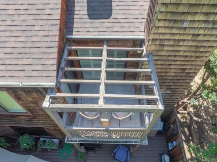 a view of a balcony with furniture