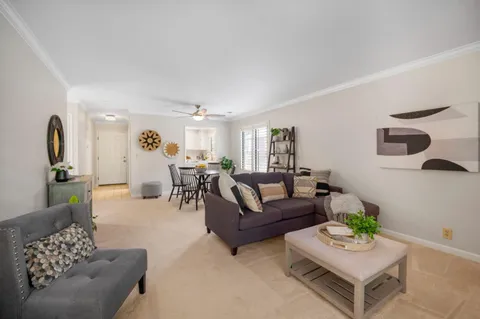 a view of a dining room with furniture and a dining table