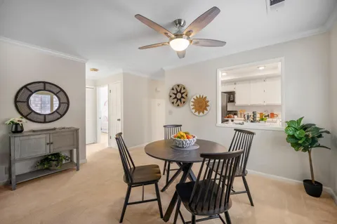 a view of a livingroom and a dining room with workspace