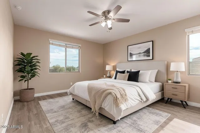 a bedroom with a large bed and a window