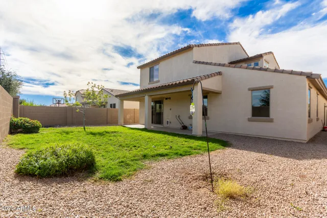 a view of a house with a yard and garage