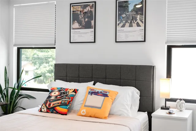 a bedroom with a bed and a couch