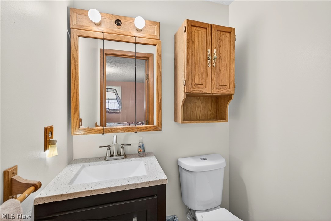 4404 Florida Street Perry, OH 44081 - Photo 13 of 24 Half bath featuring vanity and toilet