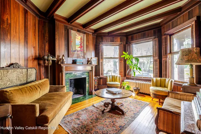 a view of an entryway with wooden floor