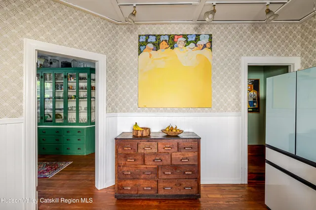 a view of a porch with a table and chairs