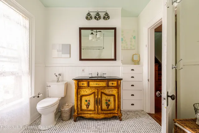 a view of a hallway with wooden floor and entryway