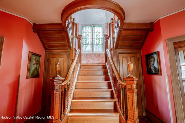 a picture of a bench in front of a wall