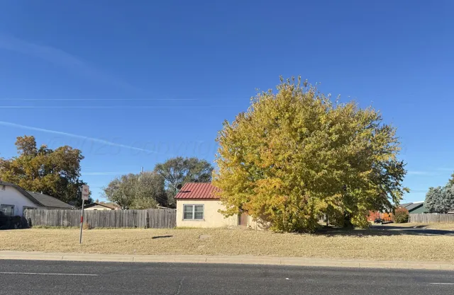 a view of a house with a street