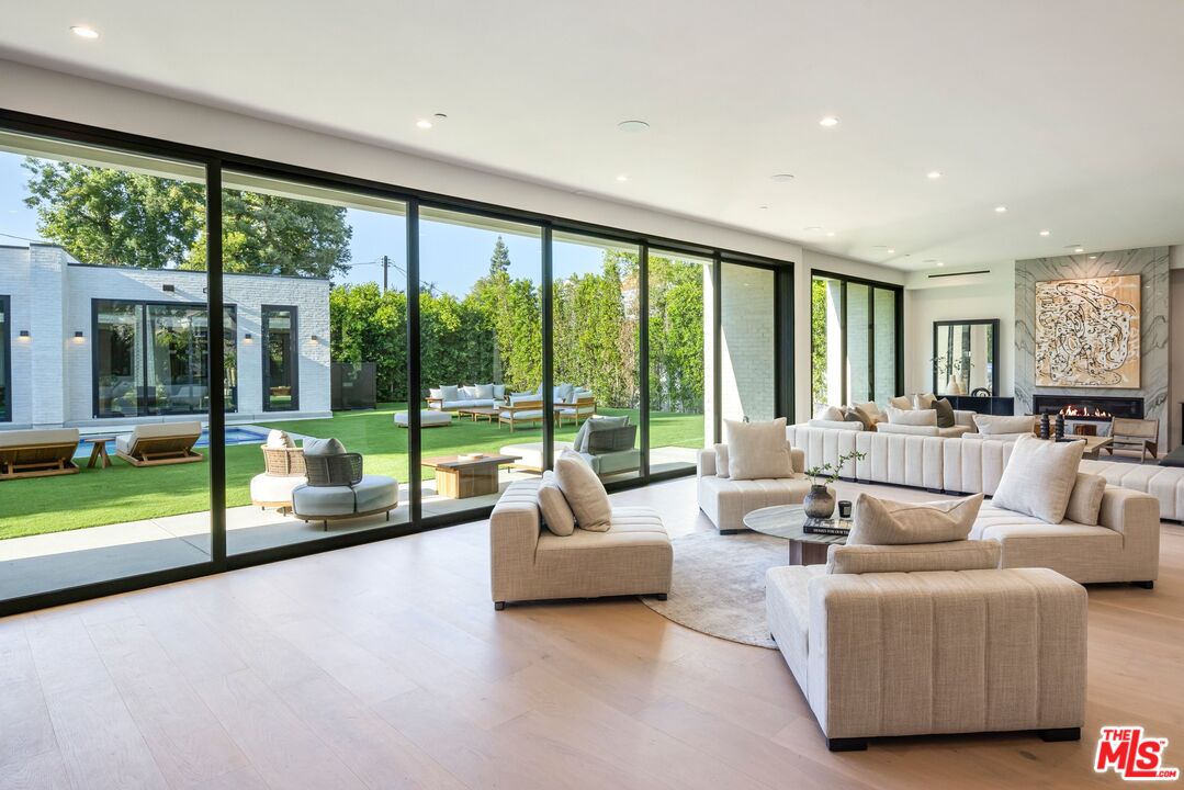 17055 Rancho Street Encino, CA 91316 - Photo 39 of 73 a living room with furniture and a large window