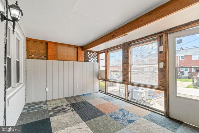 a view of a room with a large window