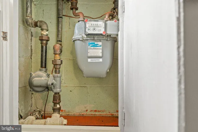 front view of a brick house next to a yard