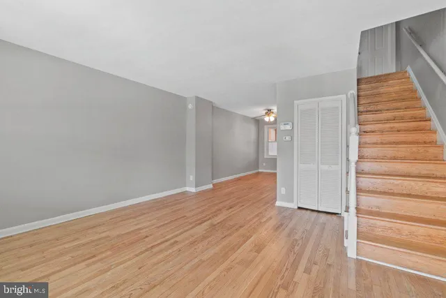 a view of hallway with wooden floor