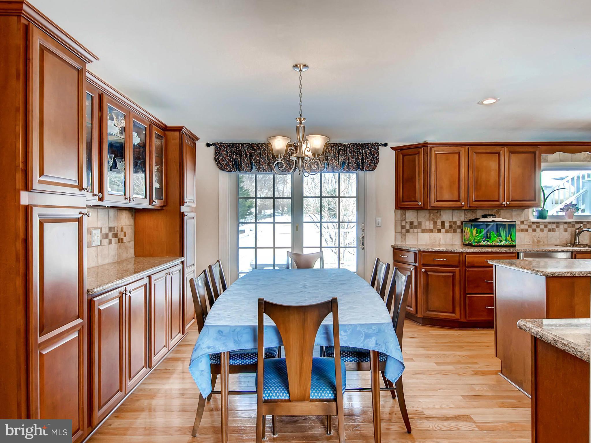 2607 Fallston Road Fallston, MD 21047 - Photo 13 of 30 a view of a dining room with furniture window and wooden floor