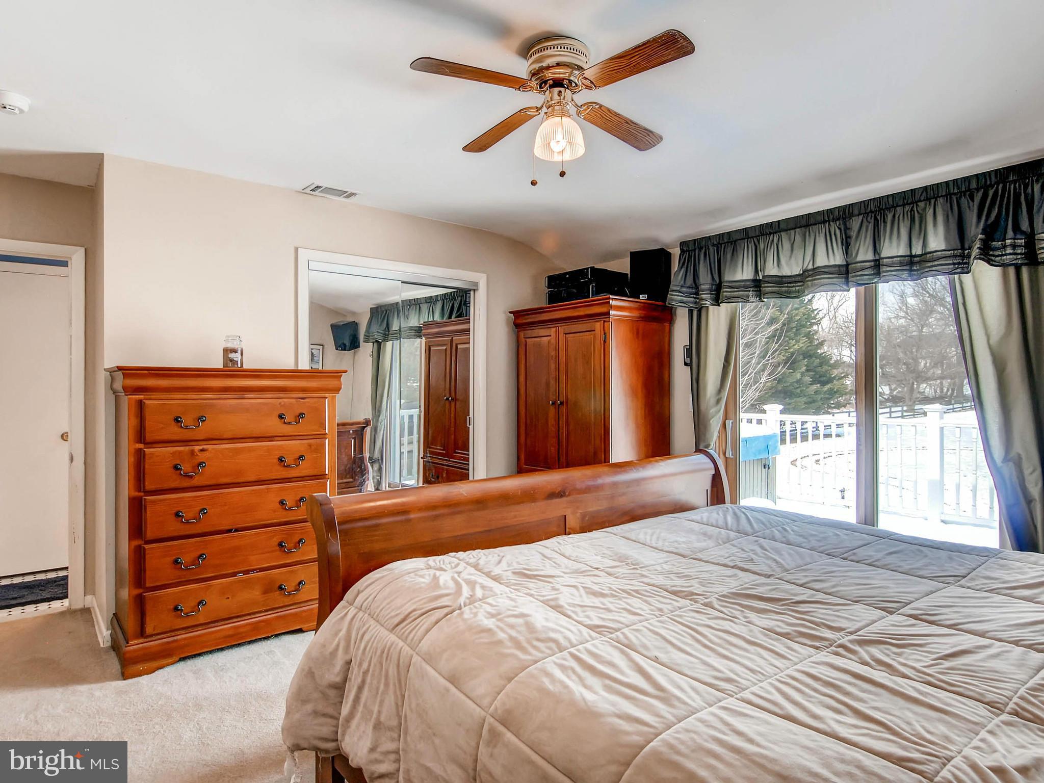 2607 Fallston Road Fallston, MD 21047 - Photo 15 of 30 a bedroom with a large bed and a large dresser