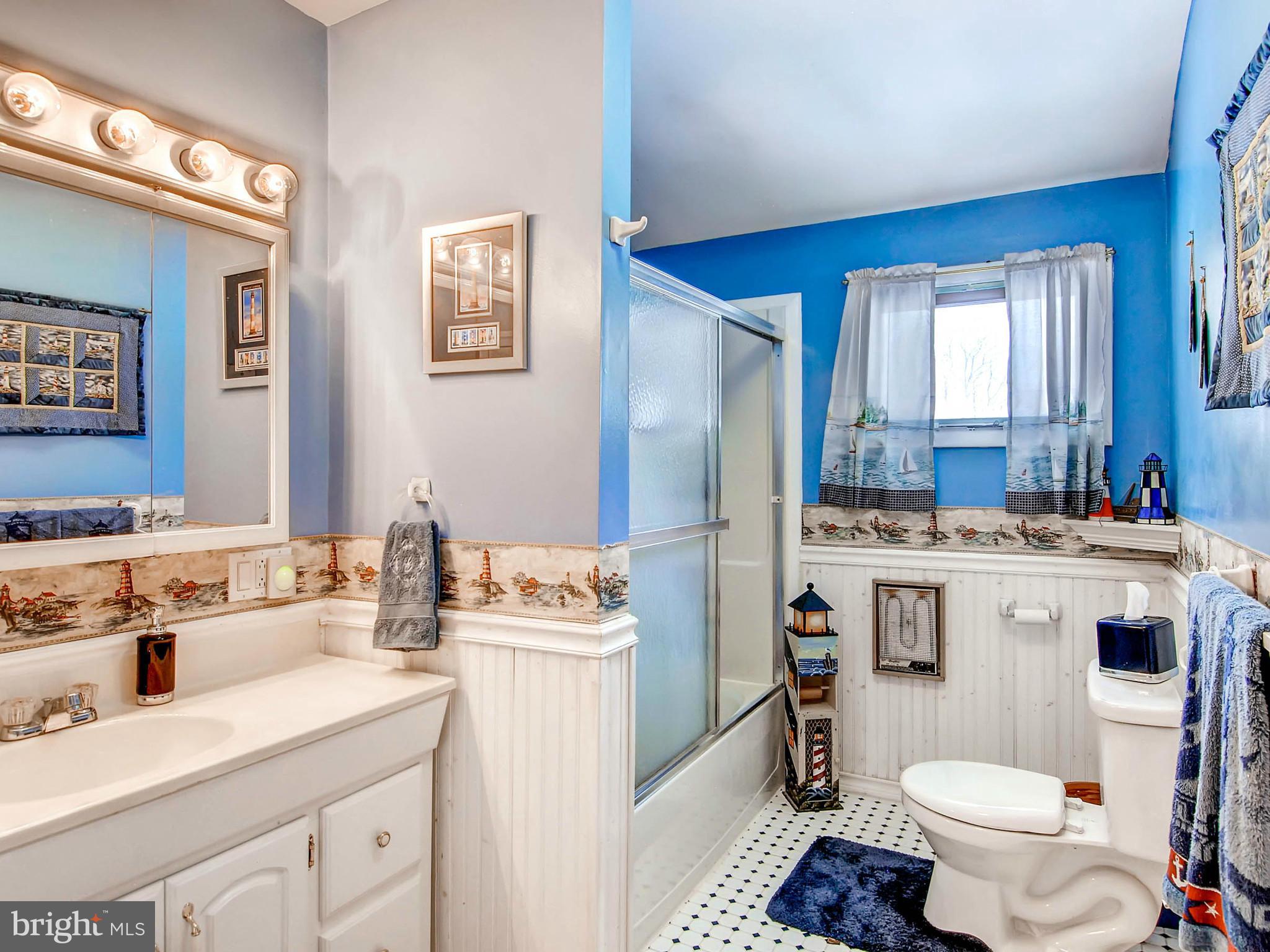 2607 Fallston Road Fallston, MD 21047 - Photo 16 of 30 a bathroom with a sink toilet vanity and window