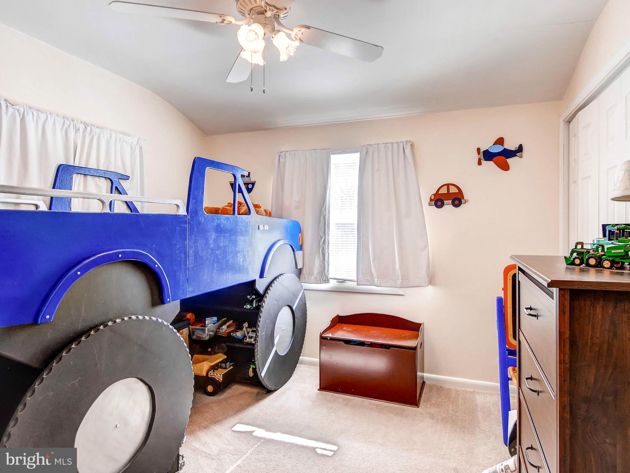 2607 Fallston Road Fallston, MD 21047 - Photo 18 of 30 a bedroom with bed and a chandelier