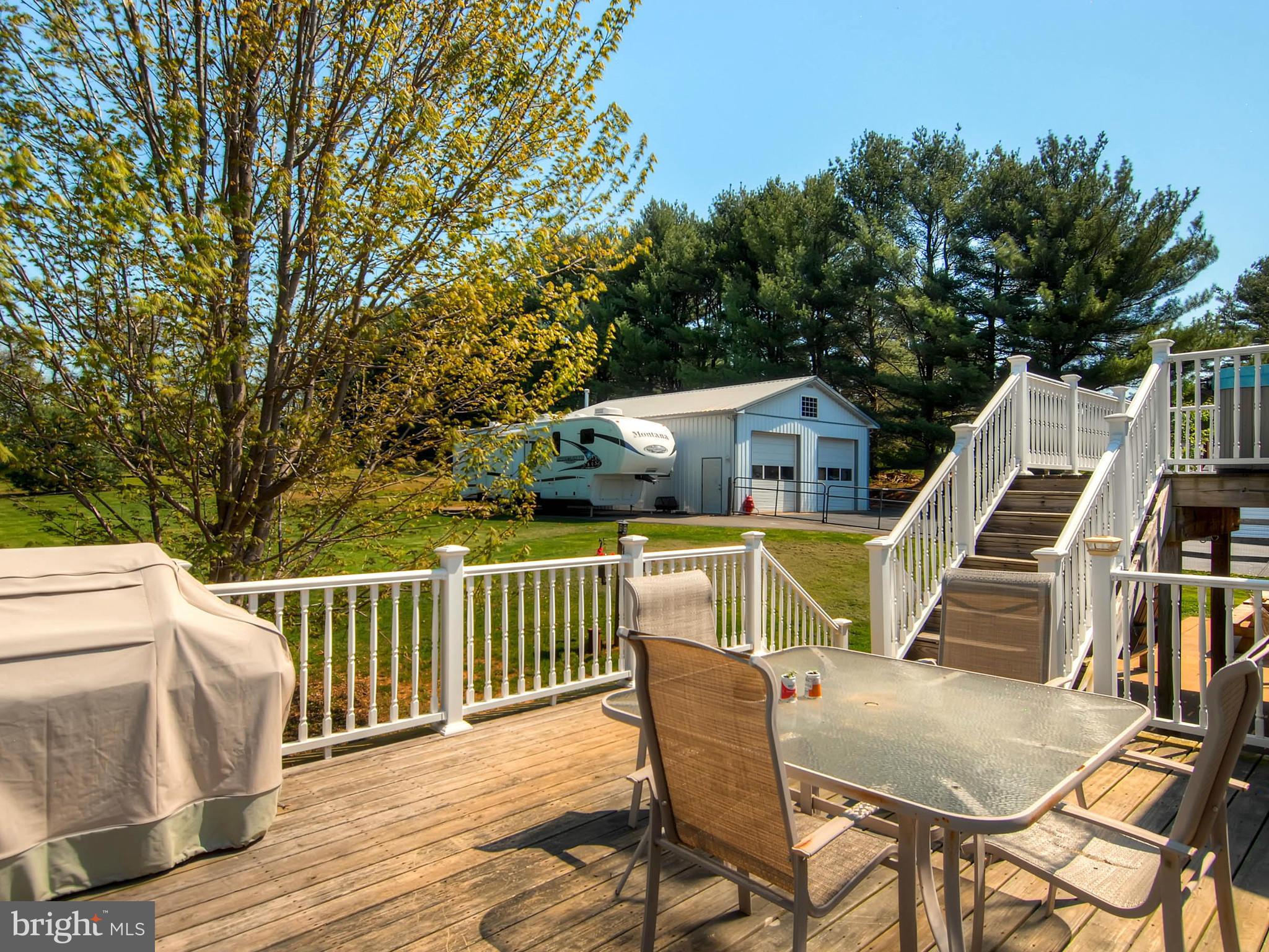 2607 Fallston Road Fallston, MD 21047 - Photo 23 of 30 a view of a deck with two chair and wooden floor