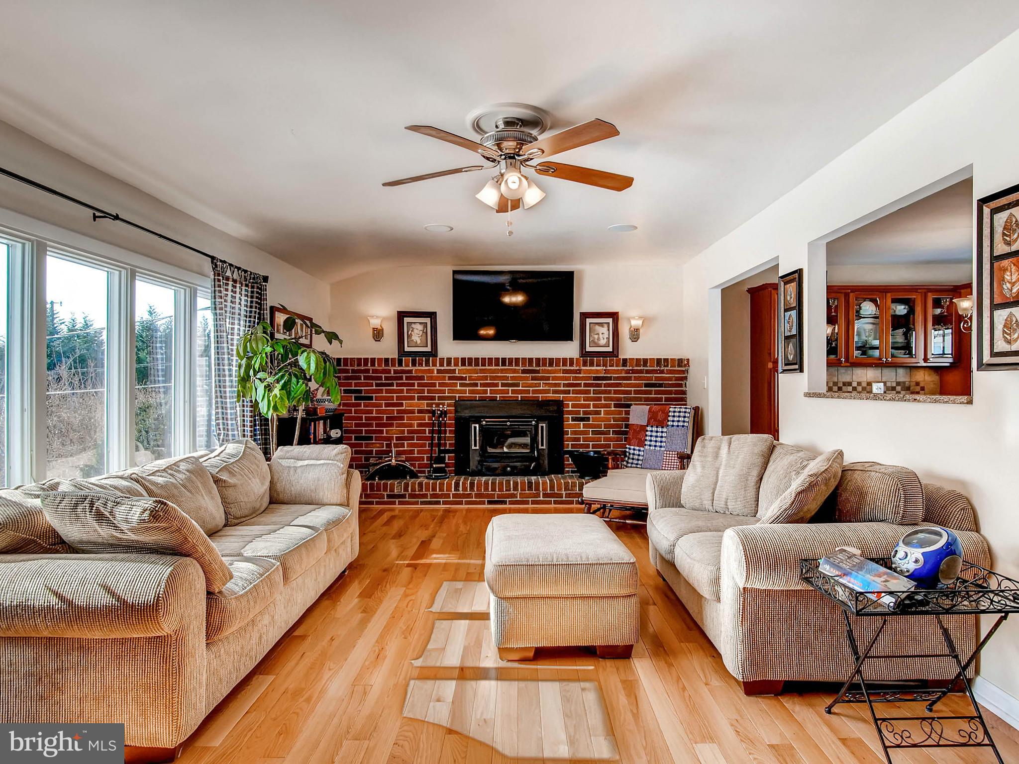 2607 Fallston Road Fallston, MD 21047 - Photo 5 of 30 a living room with fireplace furniture and a flat screen tv