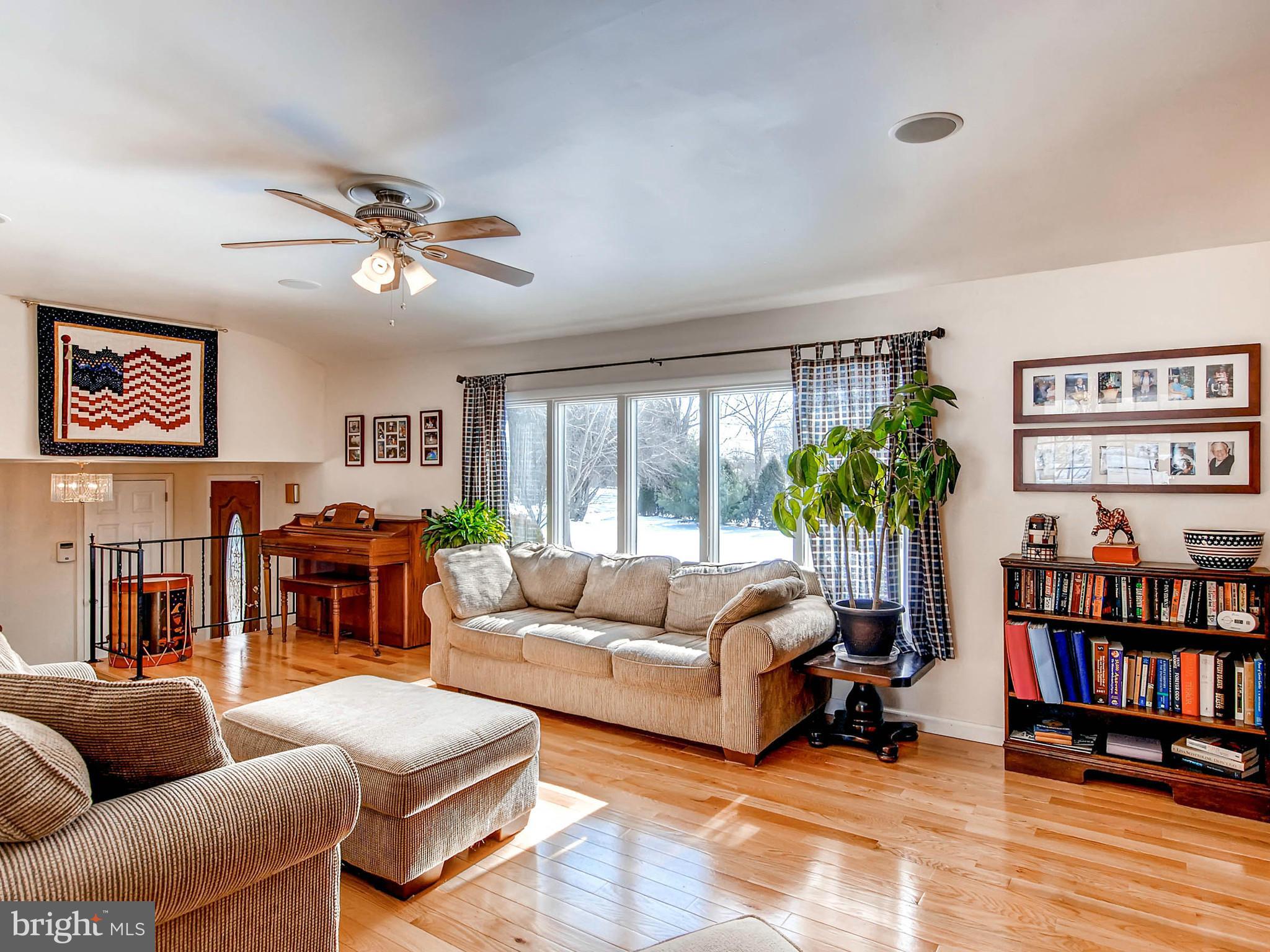 2607 Fallston Road Fallston, MD 21047 - Photo 8 of 30 a living room with furniture a bookshelf and a large window