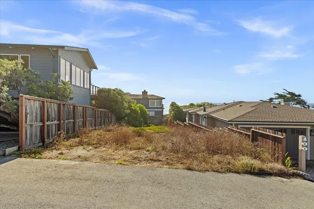 a view of a house with a street