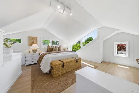 a bedroom with a bed and a couch