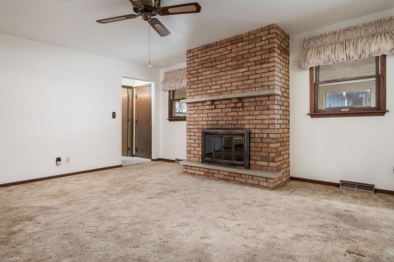 1110 Roxbury Close Rockford, IL 61107 - Photo 5 of 36 a view of an empty room with a fireplace