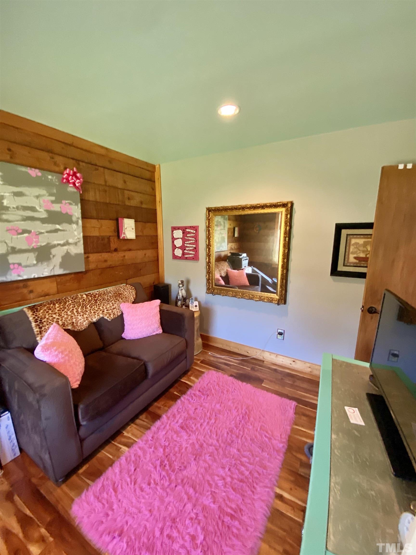 533 Enon Road Oxford, NC 27565 - Photo 20 of 95 a living room with furniture and a flat screen tv
