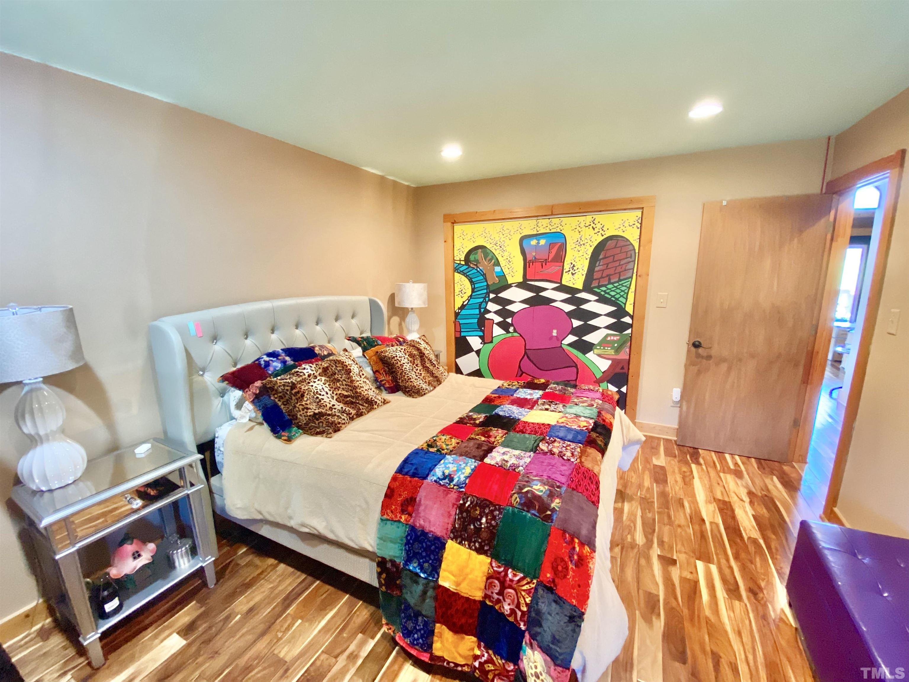 533 Enon Road Oxford, NC 27565 - Photo 23 of 95 a bedroom with a bed and a lamp