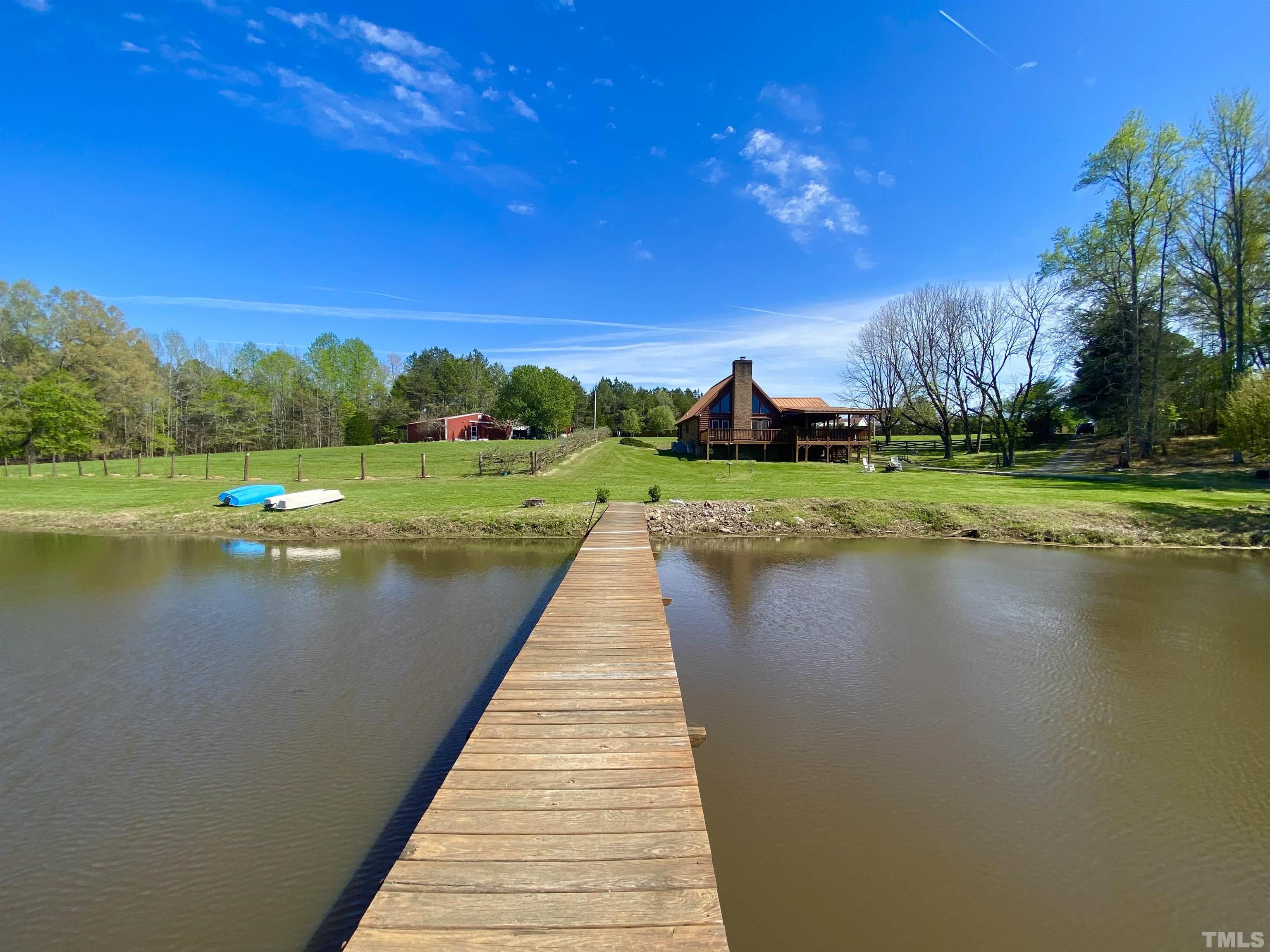 533 Enon Road Oxford, NC 27565 - Photo 3 of 95 a view of a lake with a house in the background