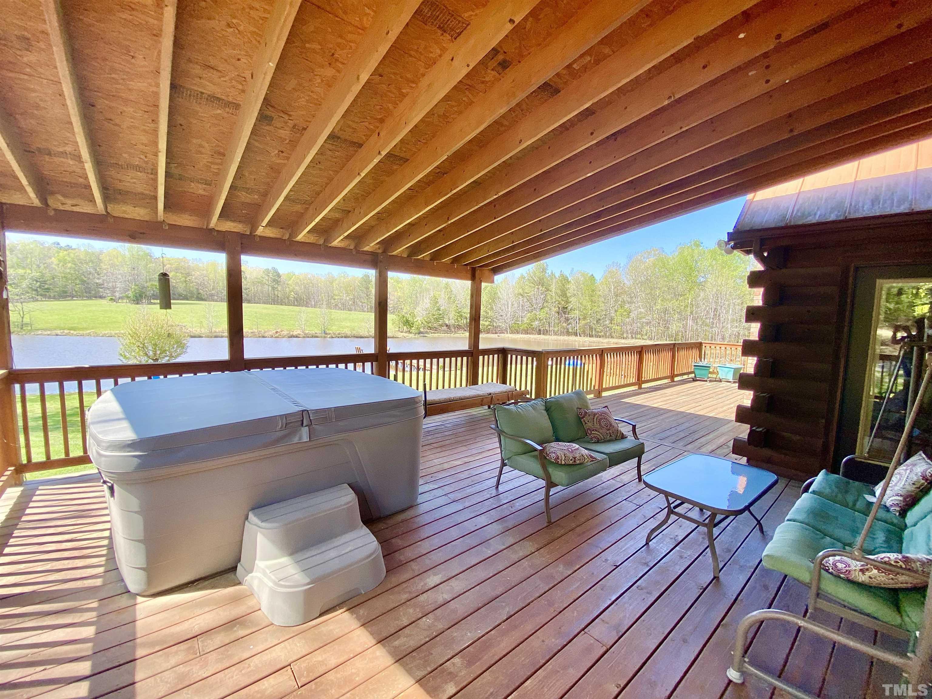 533 Enon Road Oxford, NC 27565 - Photo 32 of 95 a living room with furniture and a floor to ceiling window