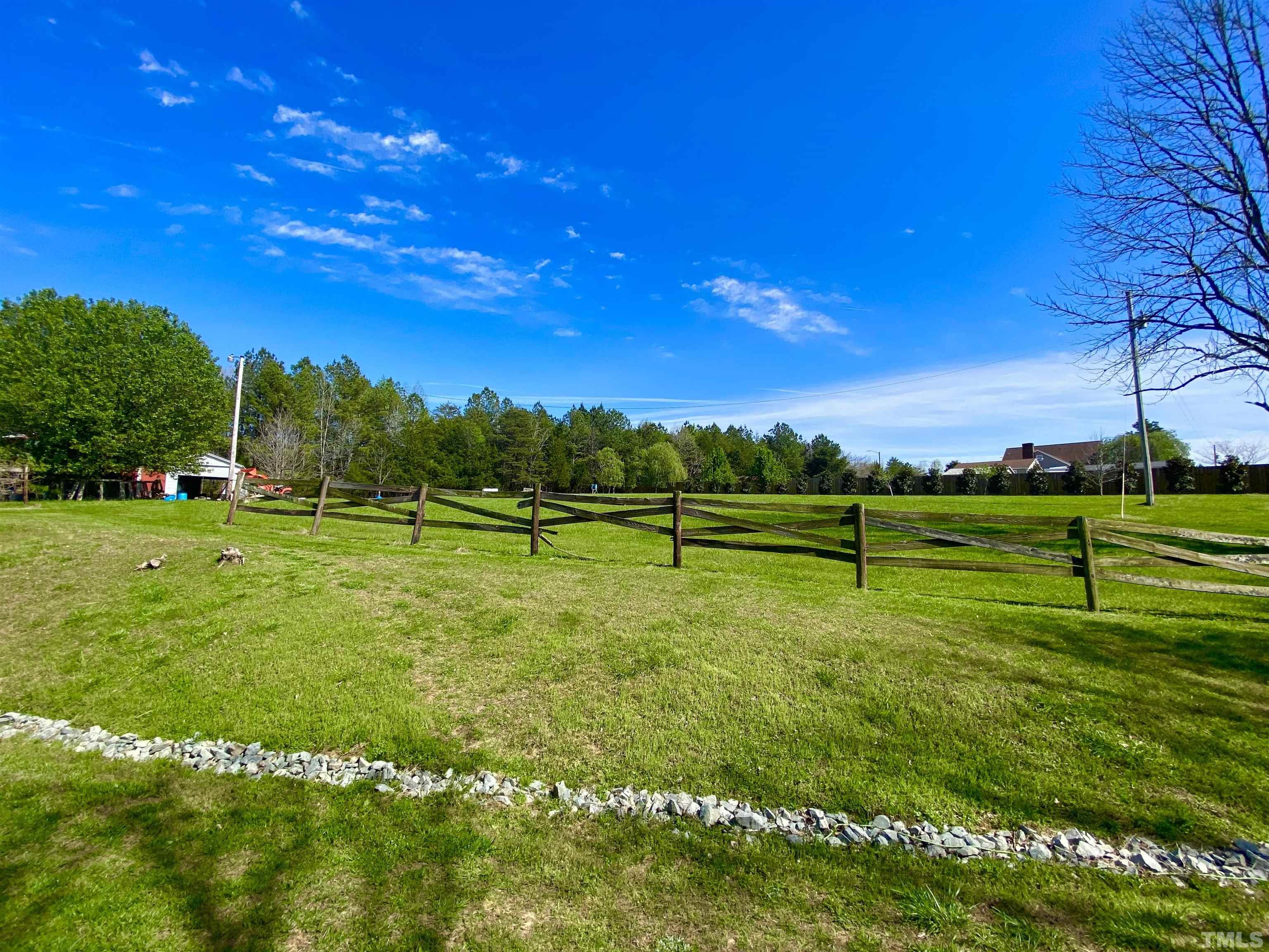 533 Enon Road Oxford, NC 27565 - Photo 36 of 95 a view of a golf course with a lake
