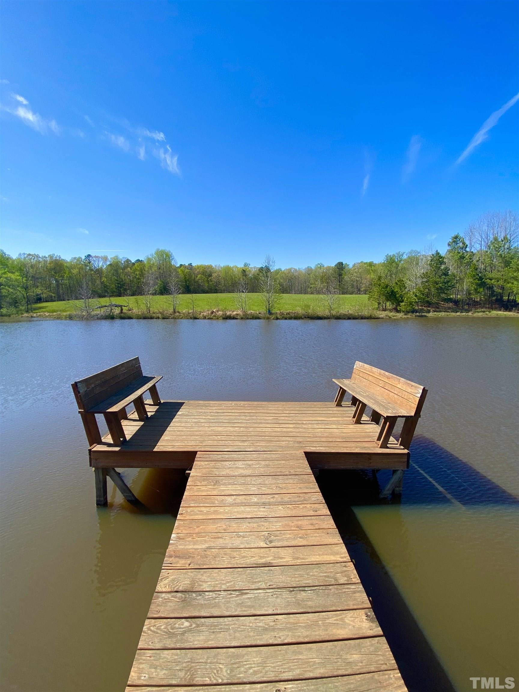533 Enon Road Oxford, NC 27565 - Photo 53 of 95 a view of a lake with a terrace