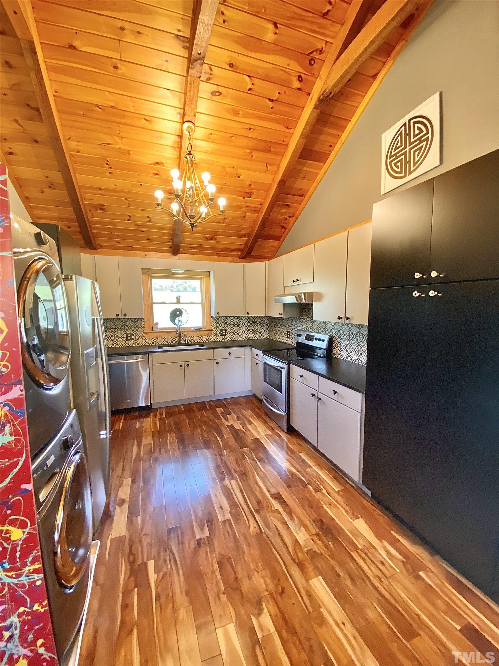 533 Enon Road Oxford, NC 27565 - Photo 6 of 95 a large kitchen with stainless steel appliances granite countertop a sink and cabinets