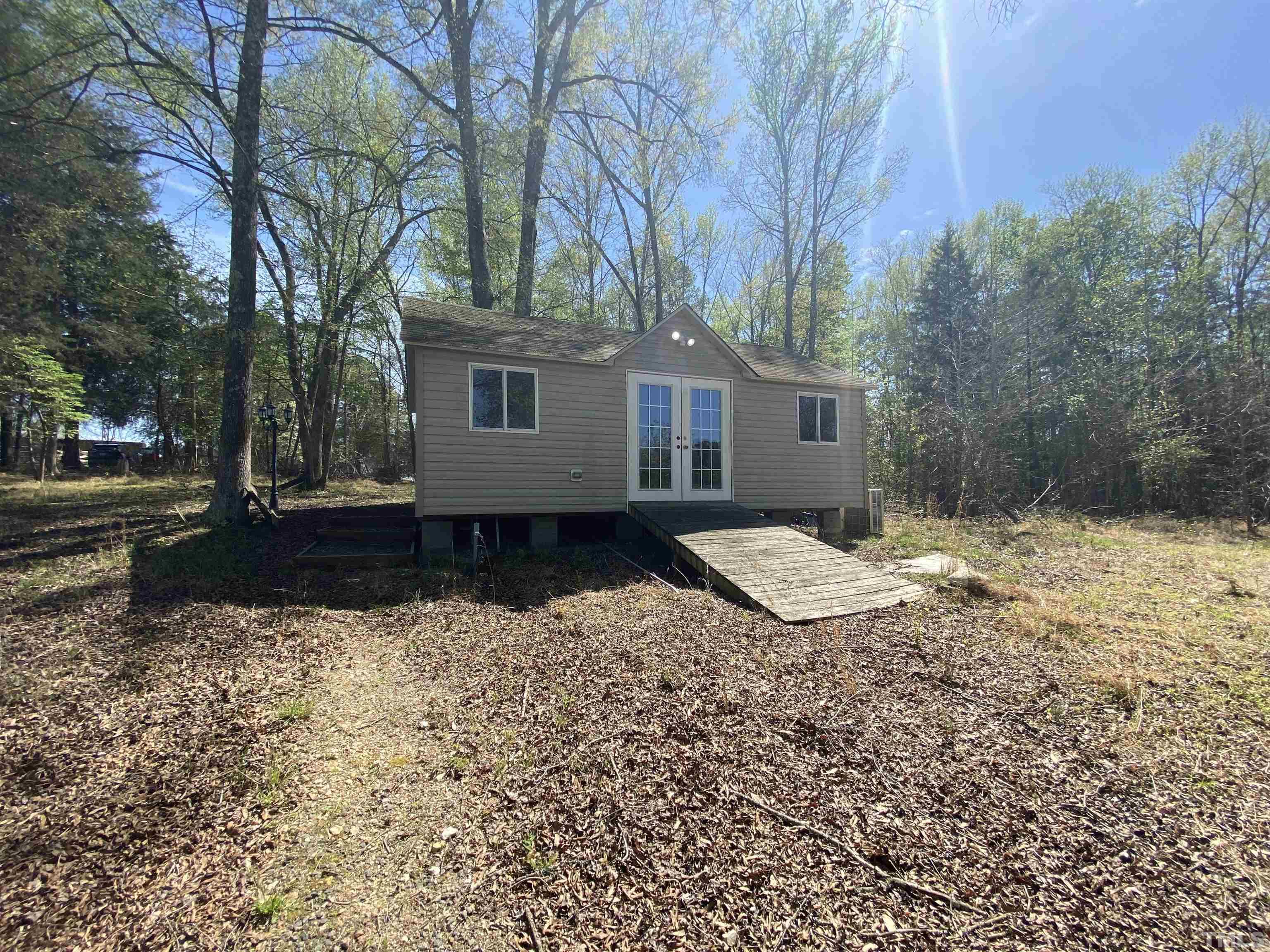 533 Enon Road Oxford, NC 27565 - Photo 64 of 95 a view of a house with a yard and large tree
