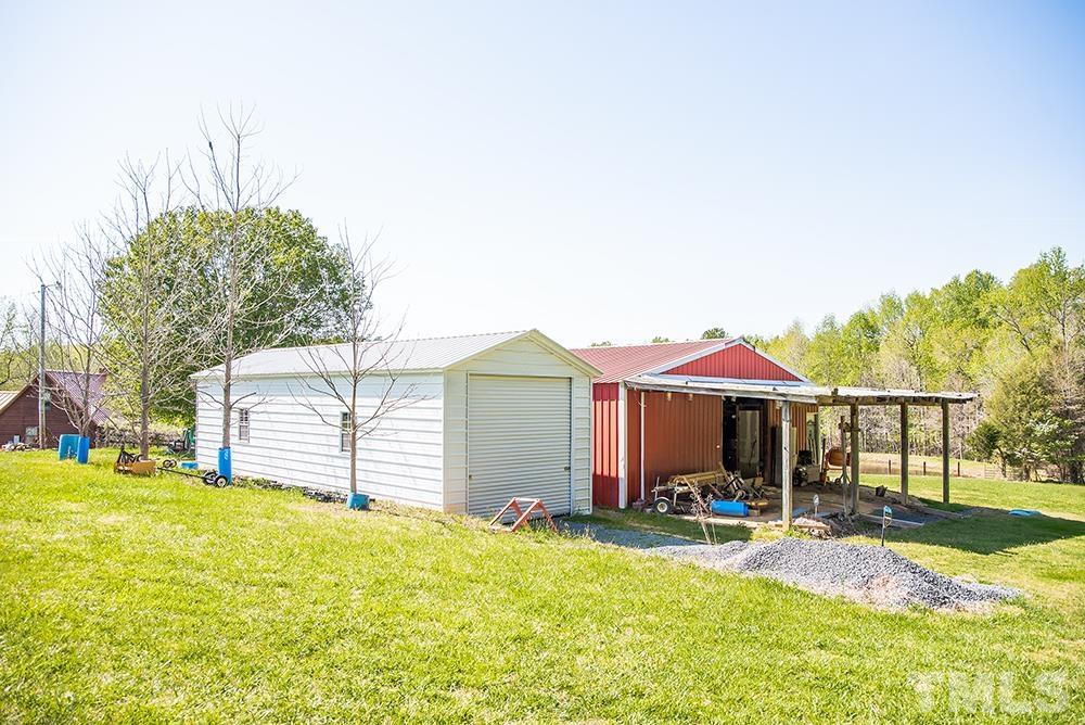 533 Enon Road Oxford, NC 27565 - Photo 78 of 95 a view of a house with a yard and sitting area