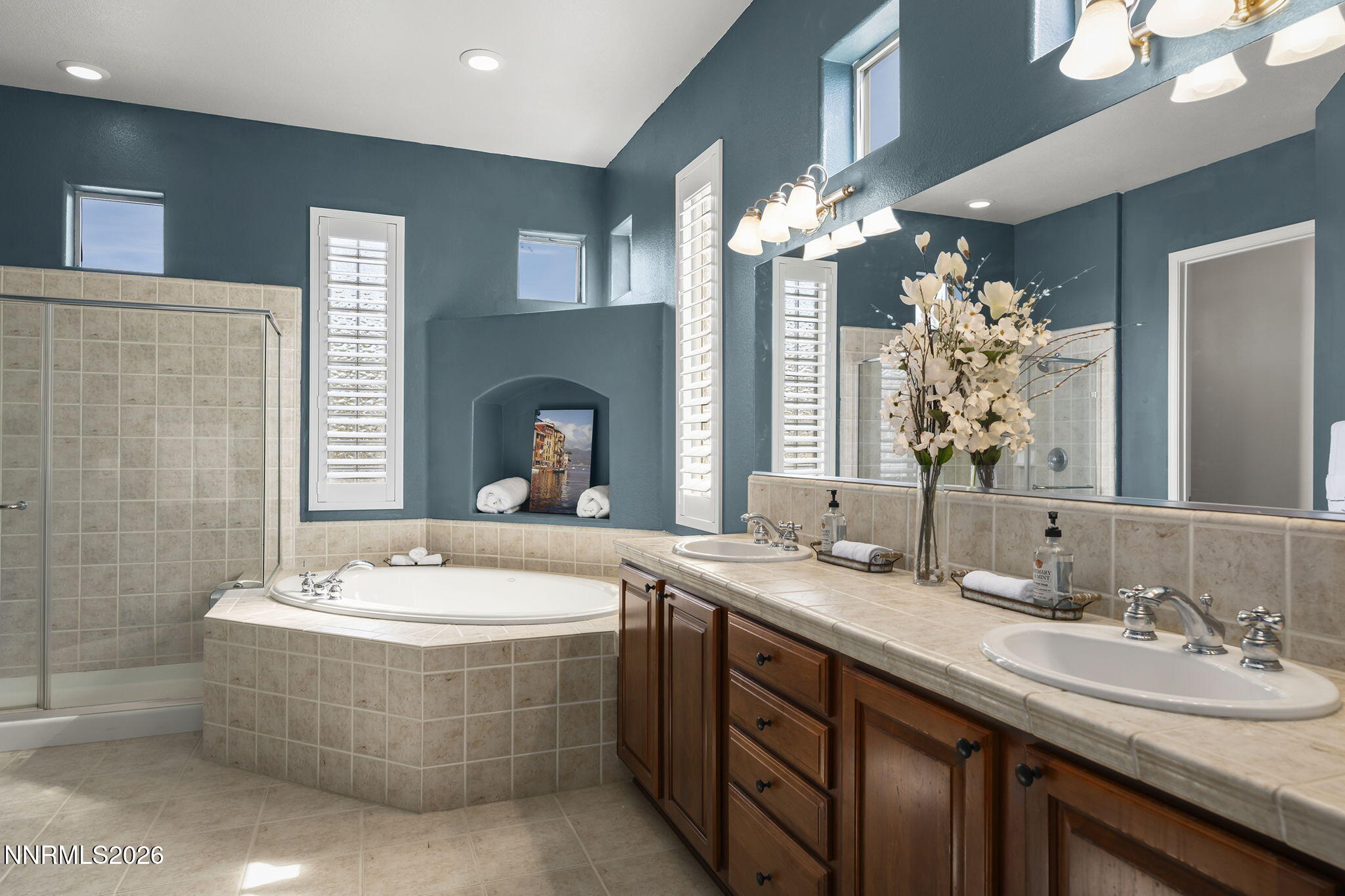 9900 Wilbur May Parkway, Unit 304 Reno, NV 89521 - Photo 19 of 47 a bathroom with a double vanity sink and a mirror