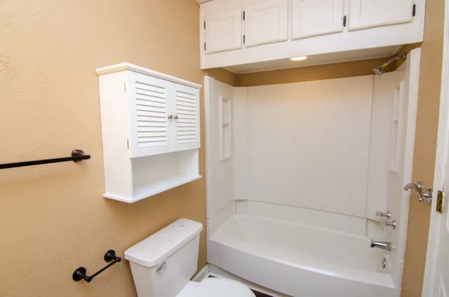 a bathroom with a bathtub and a shower