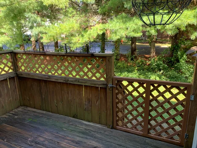 a wooden bench sitting in front of a building
