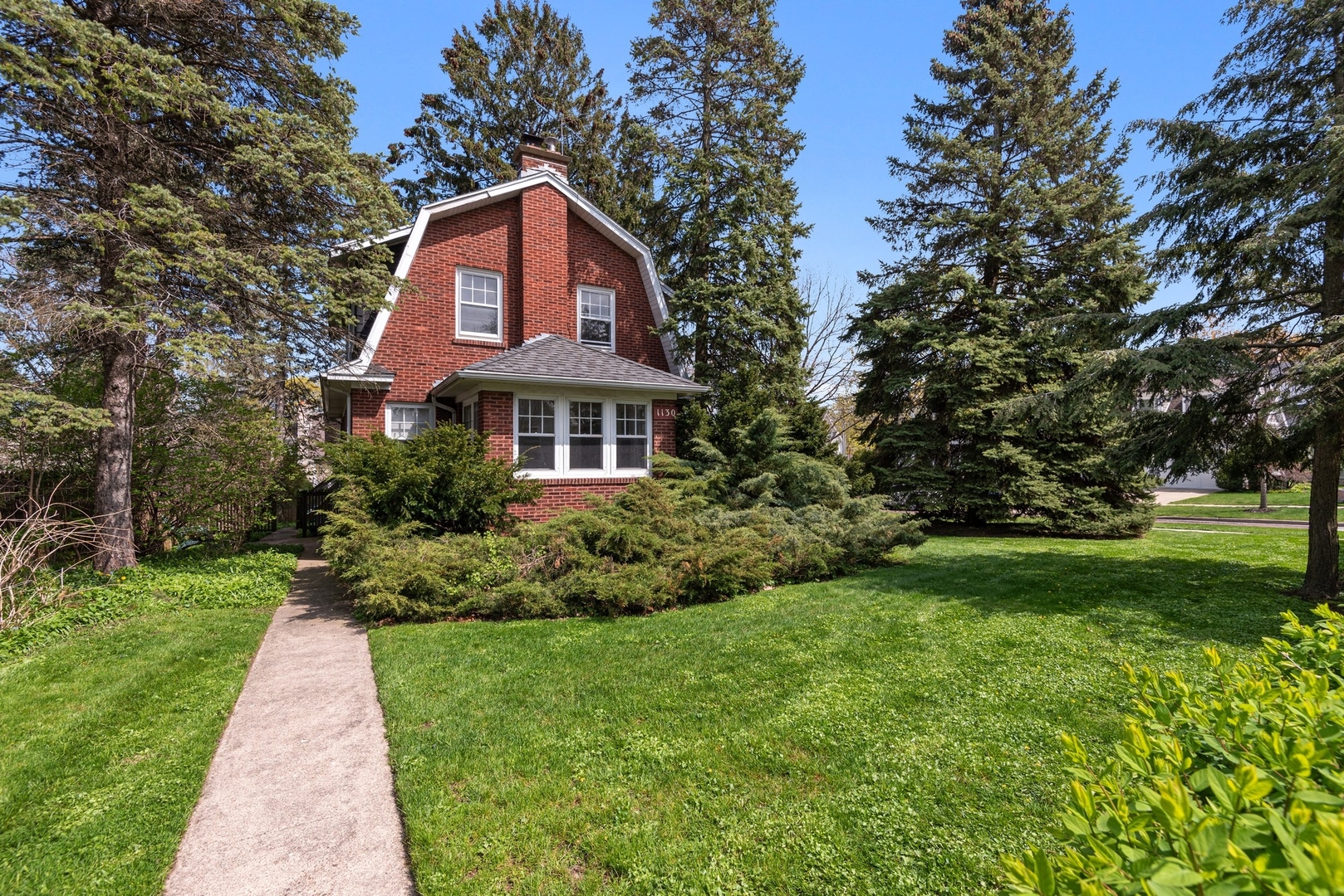 1130 Ridge Road Wilmette, IL 60091 - Photo 16 of 16 a front view of a house with a yard