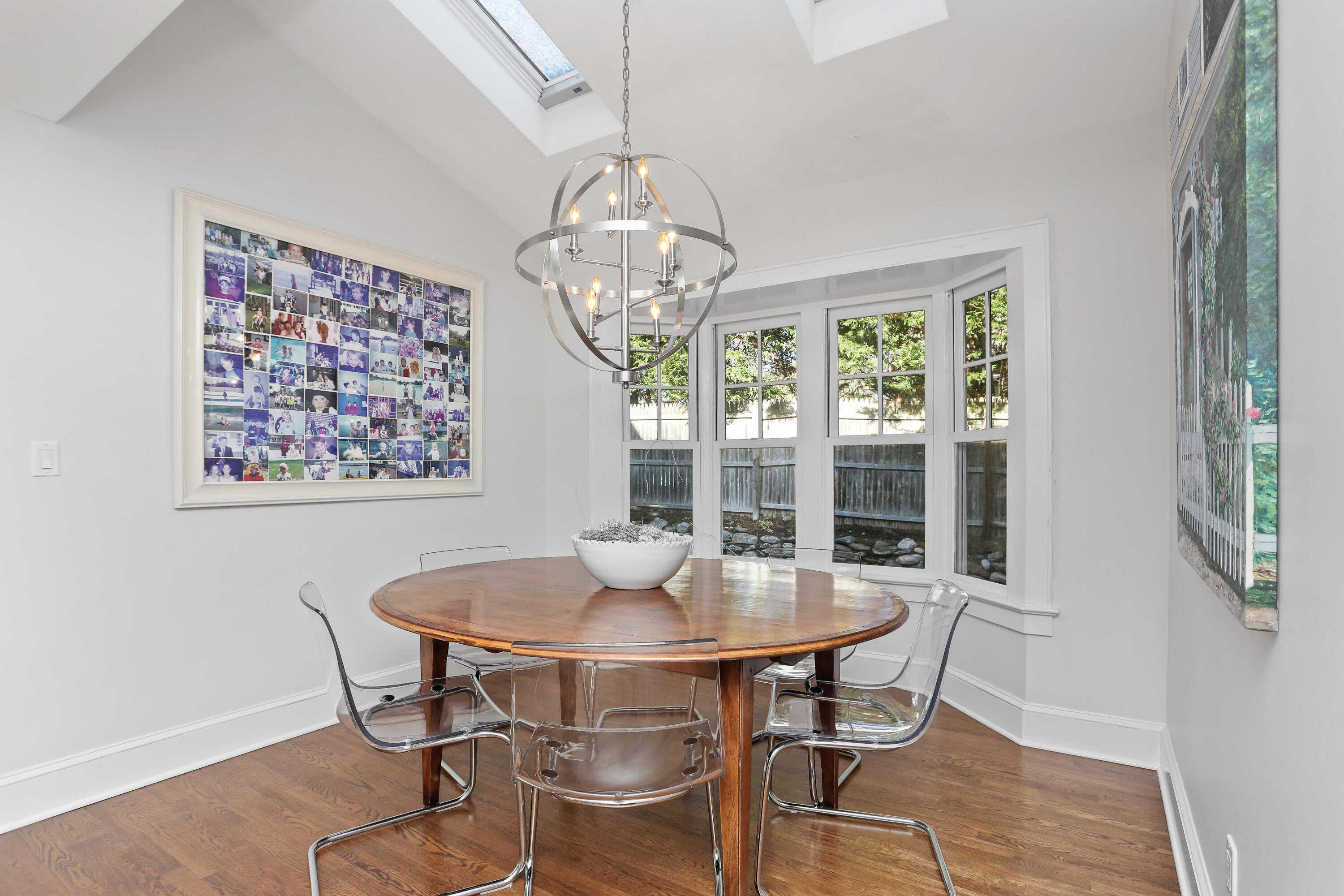 8 Beach Drive Darien, CT 06820 - Photo 12 of 27 a view of a dining room with furniture a chandelier and wooden floor
