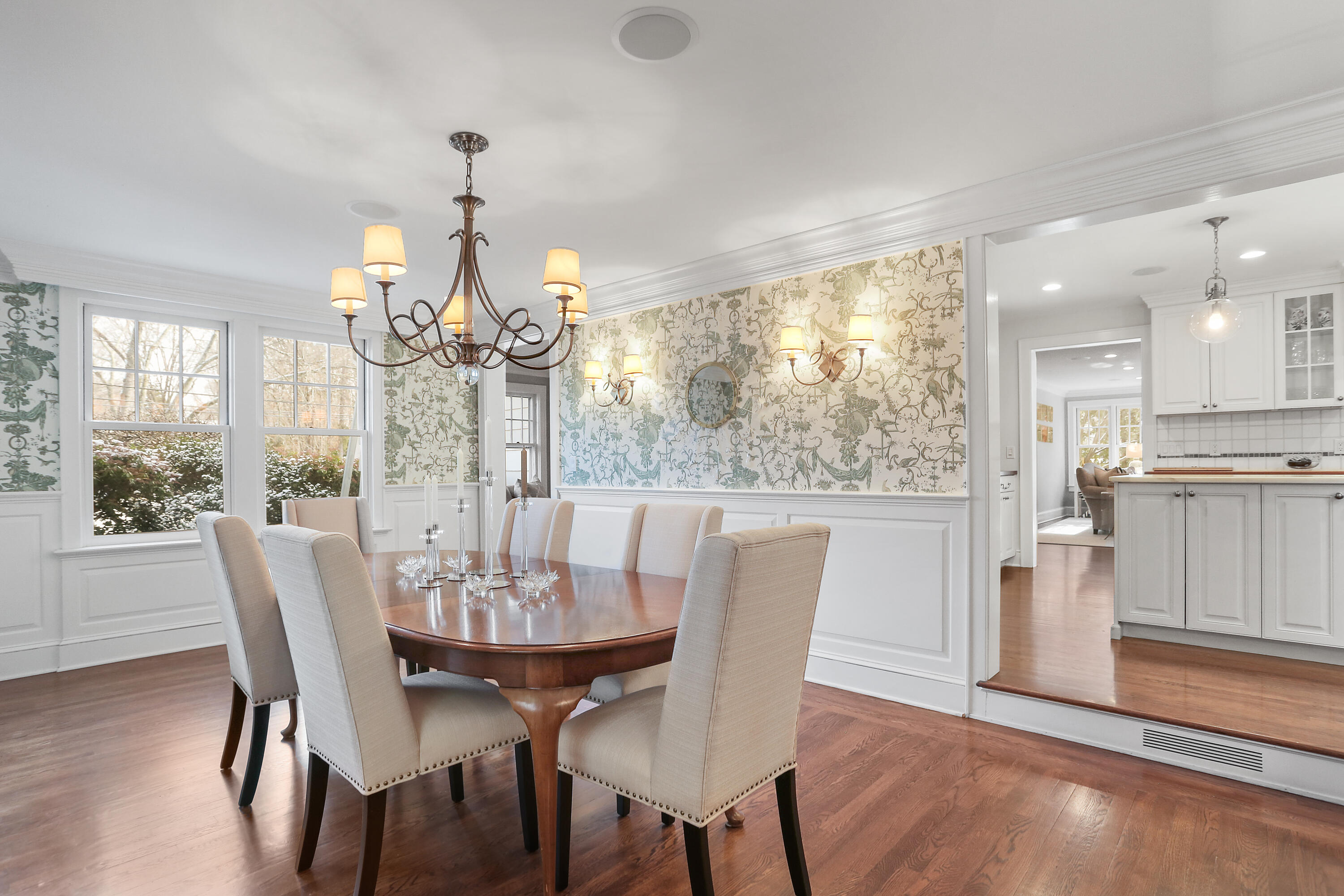8 Beach Drive Darien, CT 06820 - Photo 13 of 27 a view of a dining room with furniture a chandelier and wooden floor
