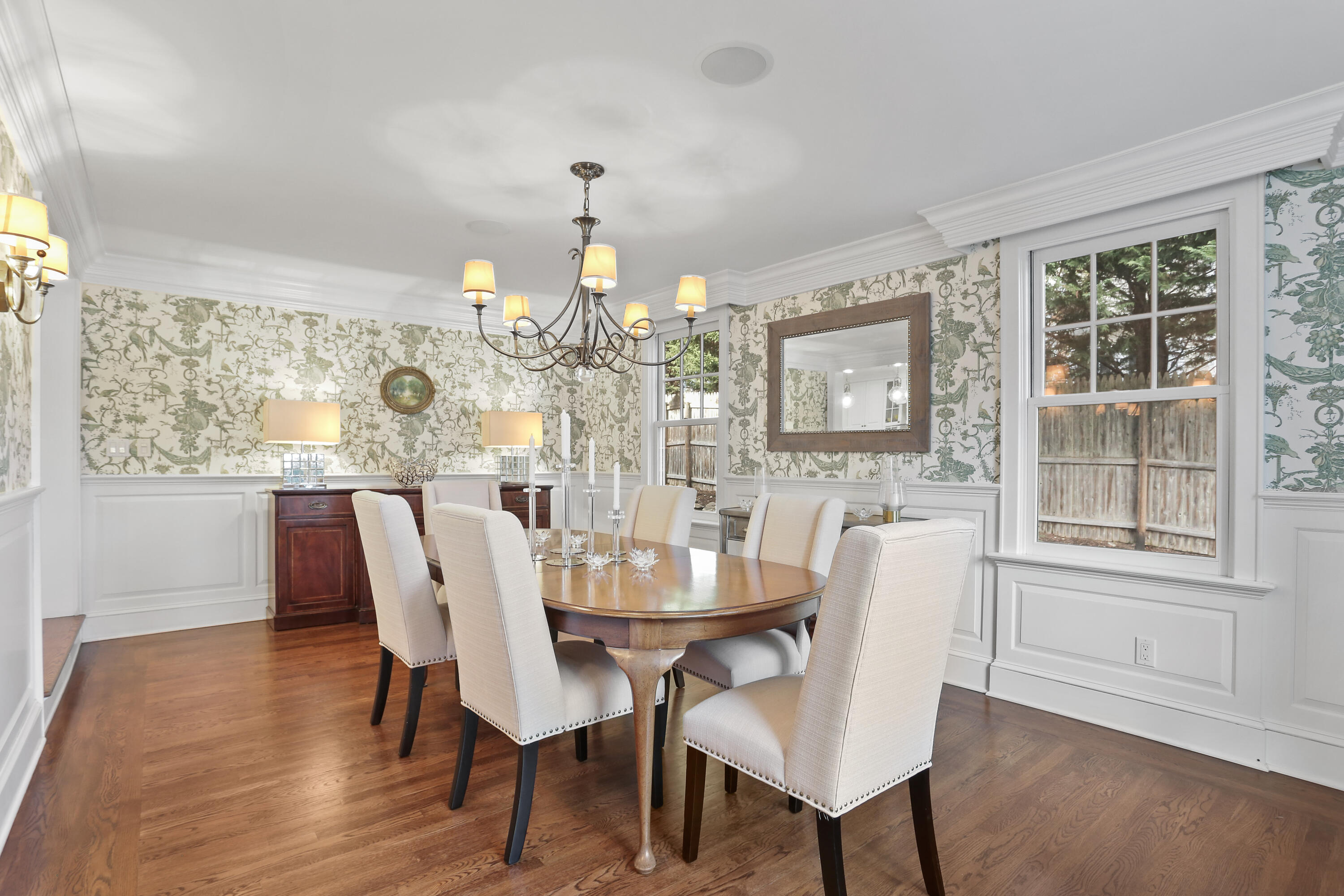 8 Beach Drive Darien, CT 06820 - Photo 14 of 27 a view of a dining room with furniture wooden floor and chandelier