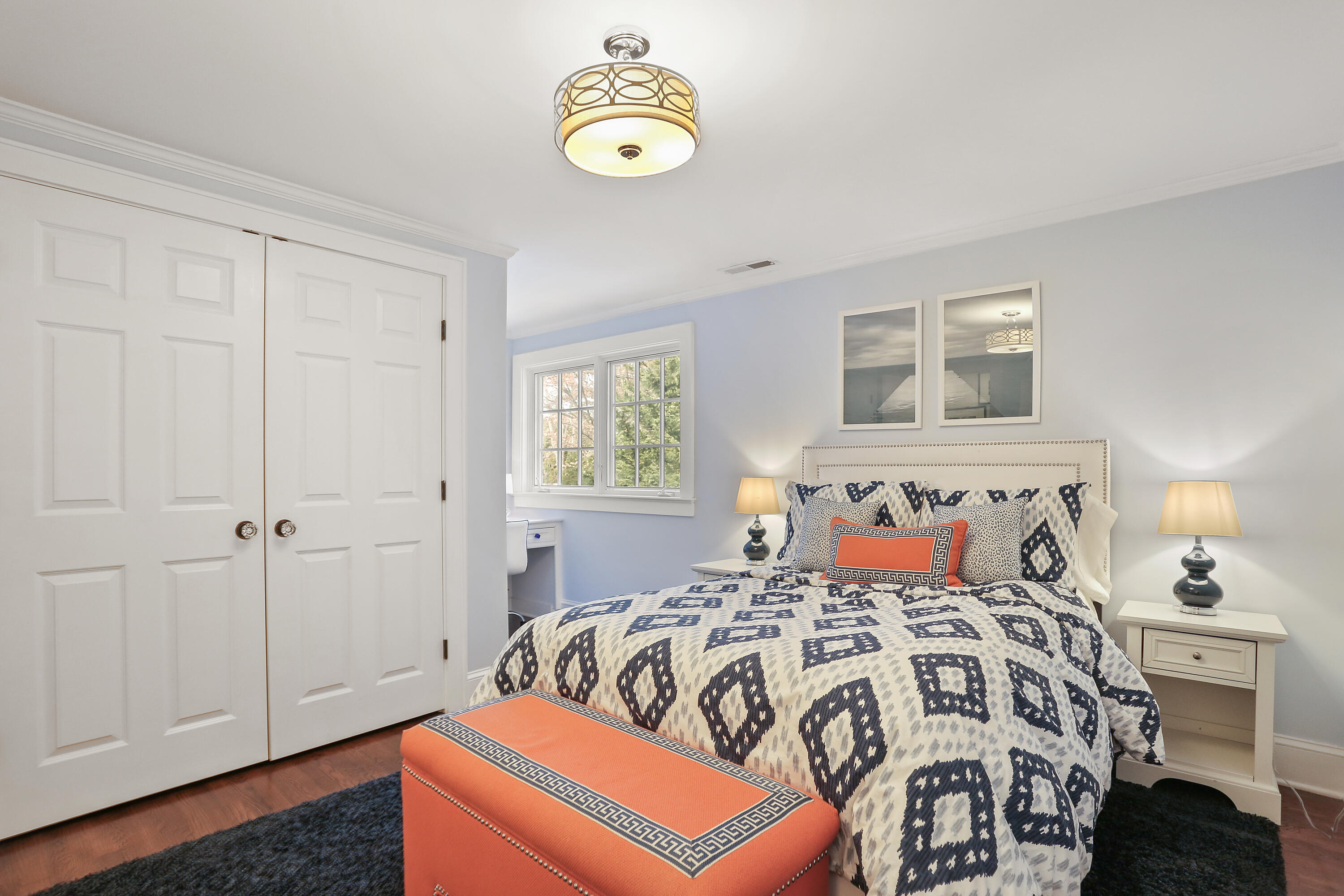 8 Beach Drive Darien, CT 06820 - Photo 18 of 27 a bedroom with a bed and painting on the wall